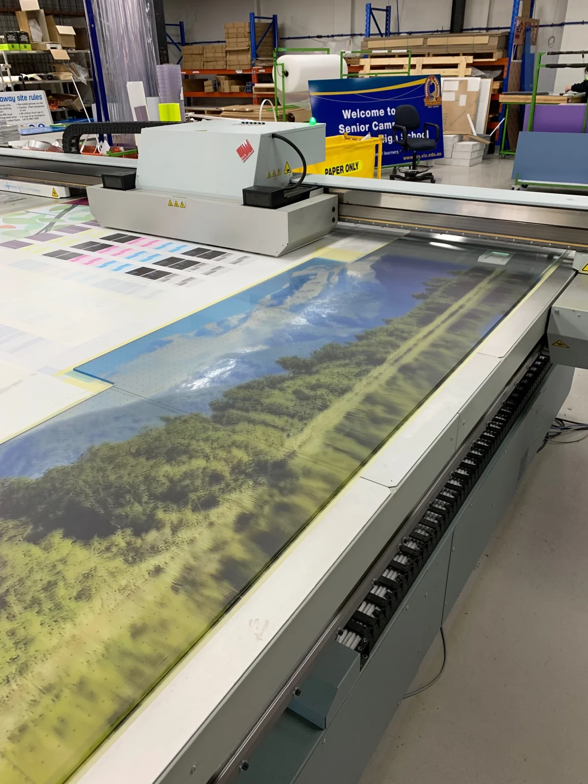 Landscape artwork being printed on workshop equipment