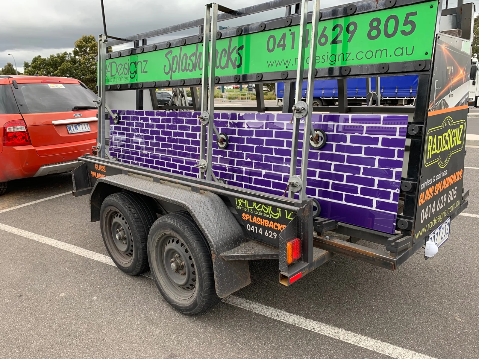 RADesignz trailer carrying purple printed glass panels