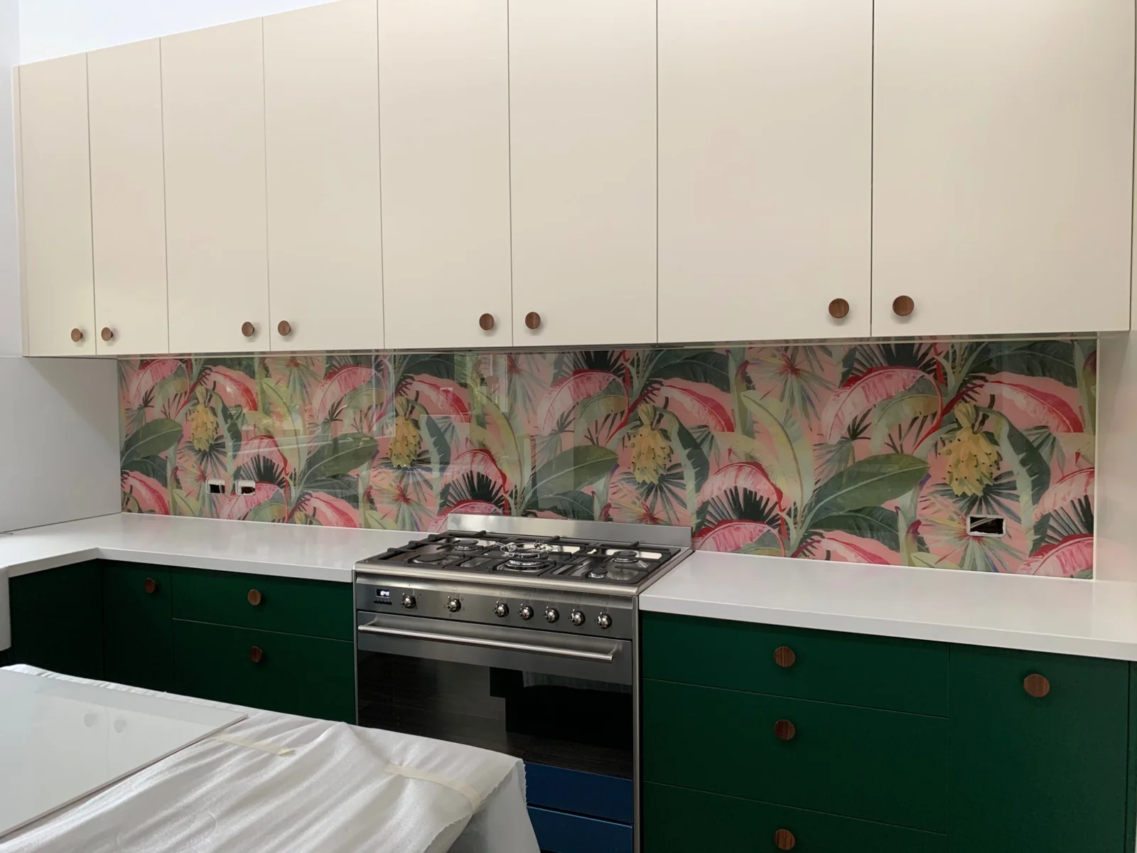 Colourful botanical pattern printed on a kitchen splashback