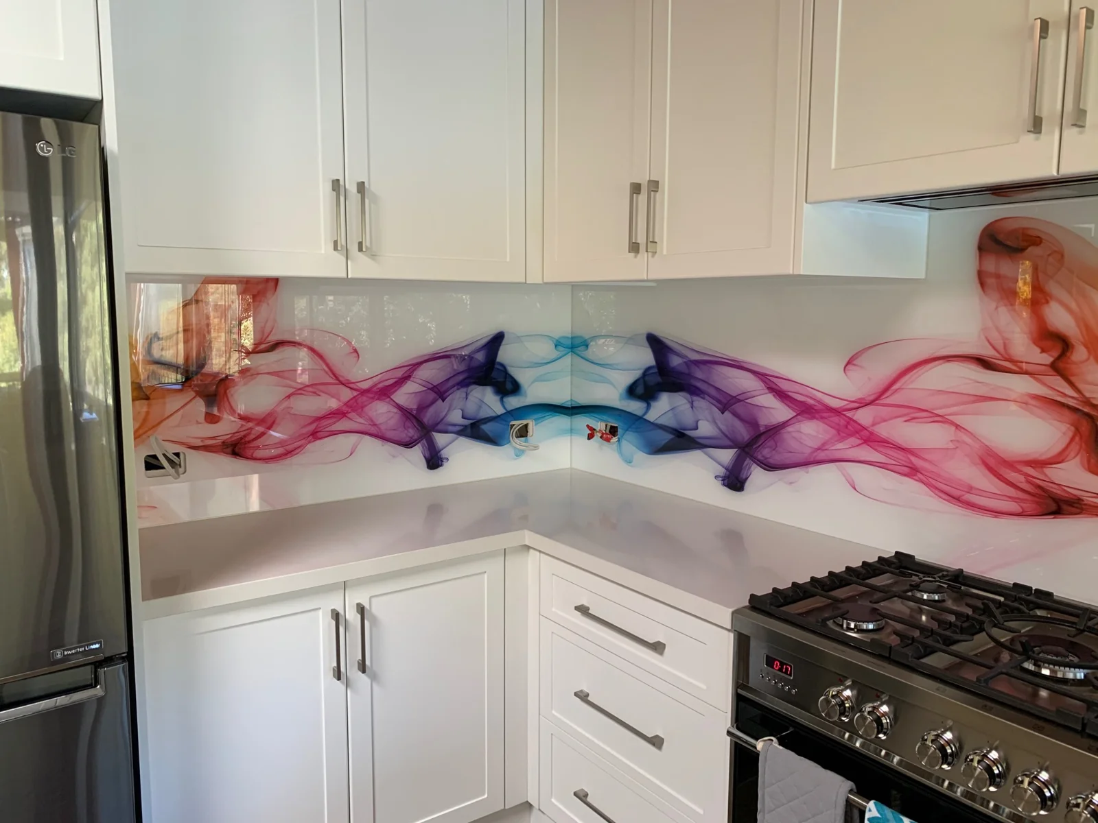 Alternative angle of colourful abstract kitchen glass splashback