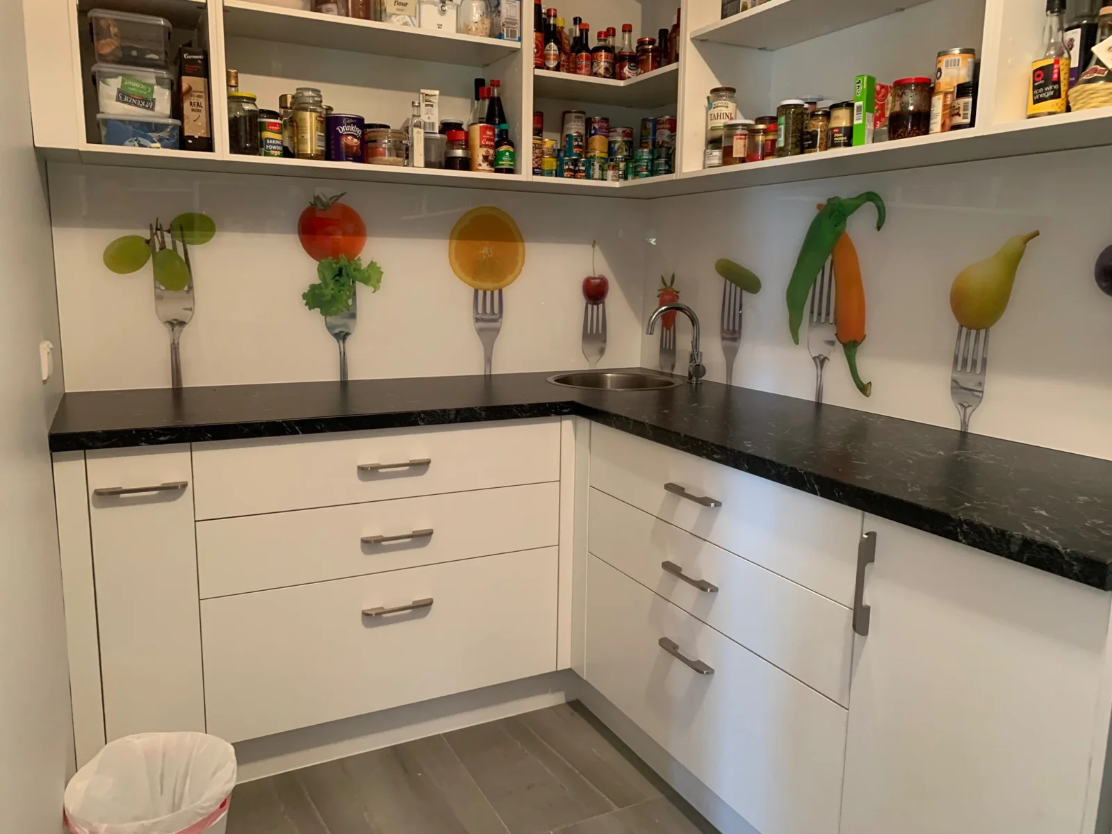 Fruit and cutlery artwork on pantry glass panels