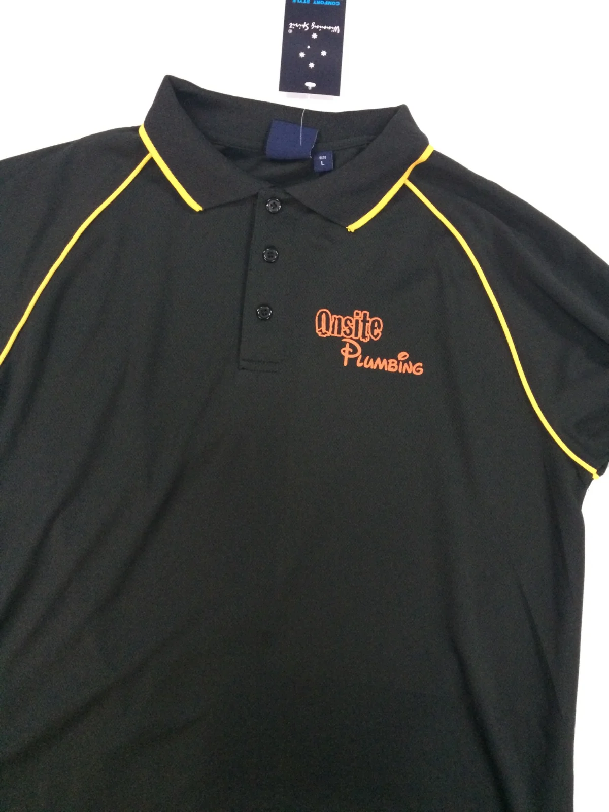 Black polo shirt with embroidered branding