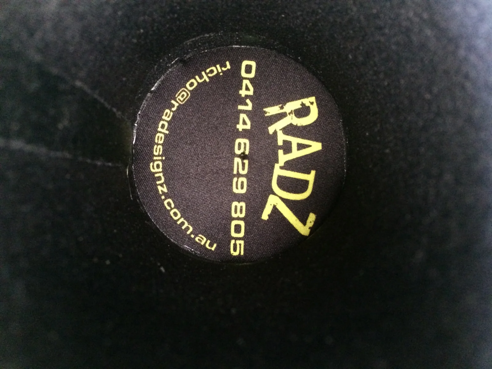 Gold RADesignz embroidery on black fabric